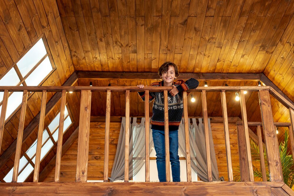 Boy with exposed rafter country style home.